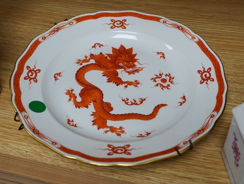 A Meissen dish, painted with a green dragon, 25.5cm diameter, another painted with an iron red dragon and a tea caddy (3). Condition - good